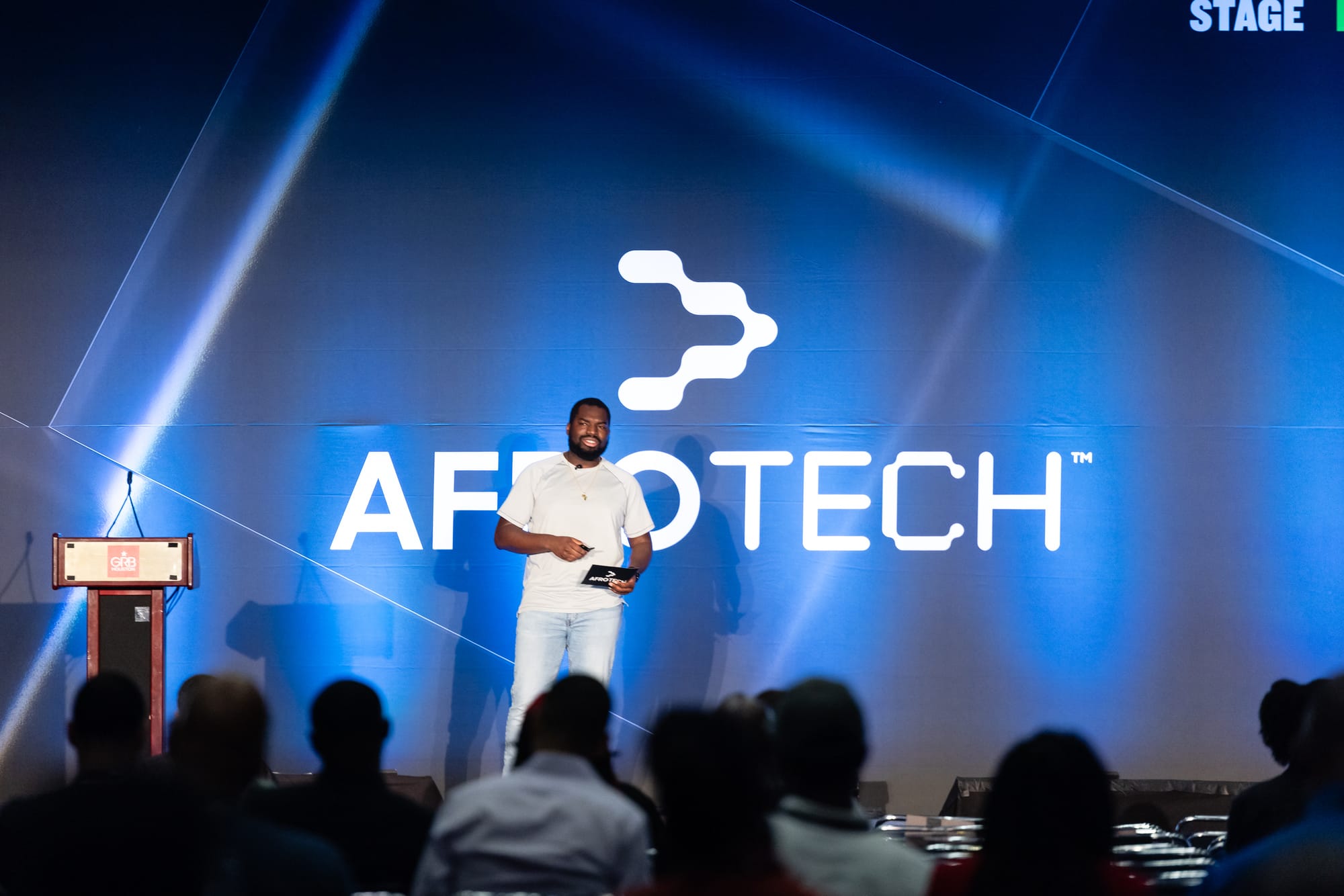 Alex presenting his talk at AfroTech 2024