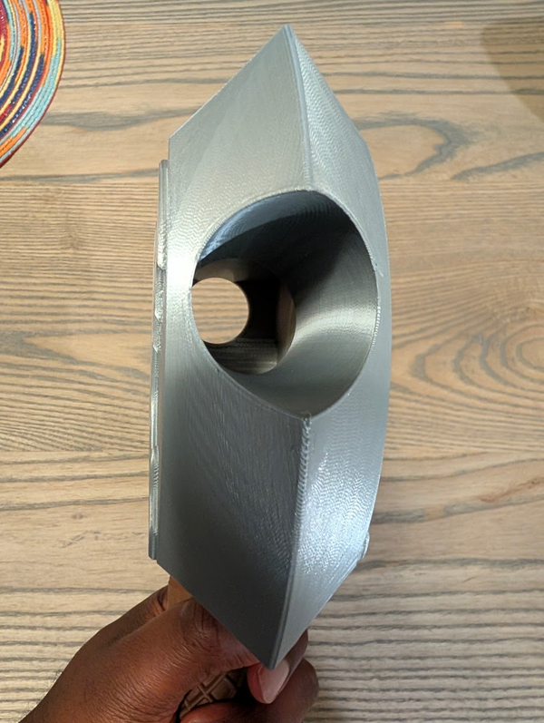 The axe head from the side, showing the hollow chamber the dice roll through